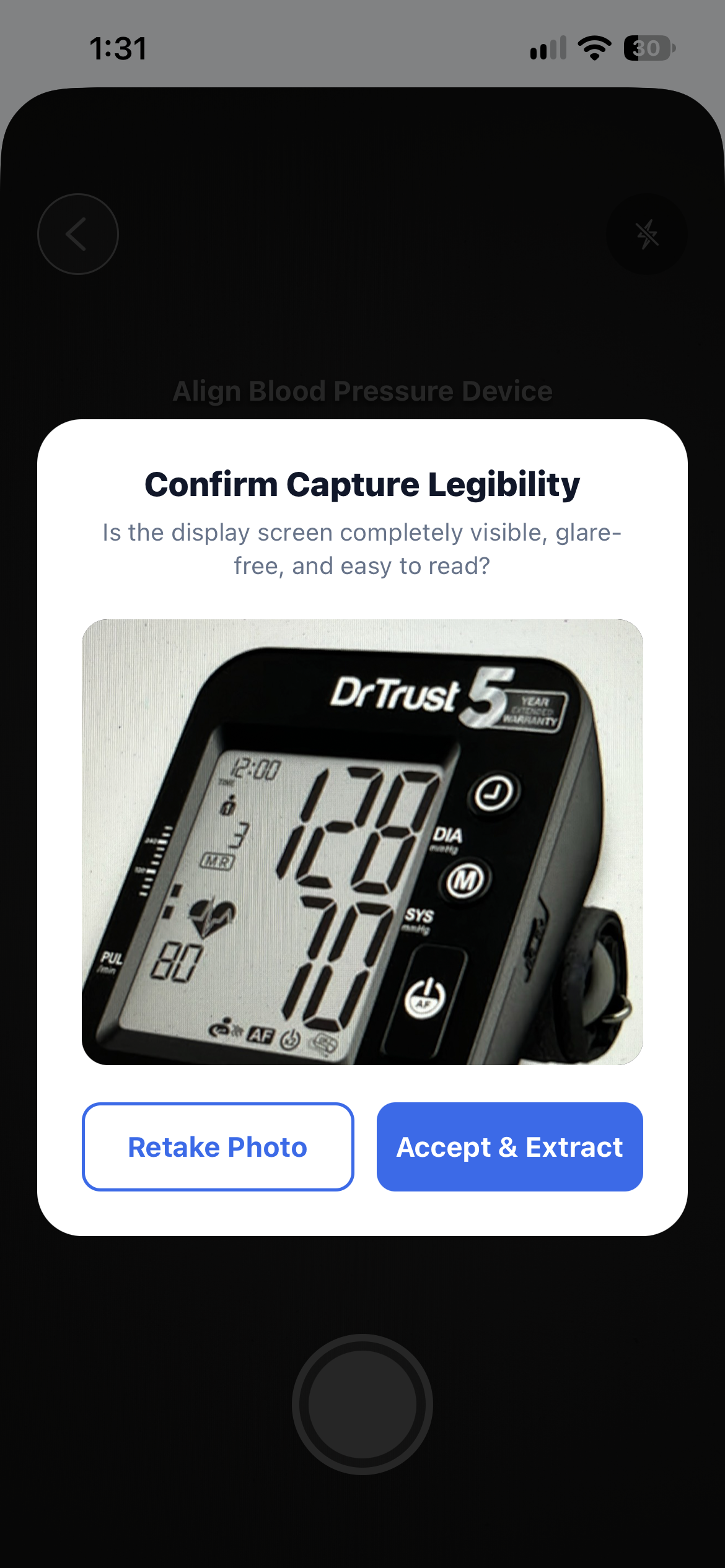 Prompt asking whether the photo of the blood pressure monitor is clear before continuing